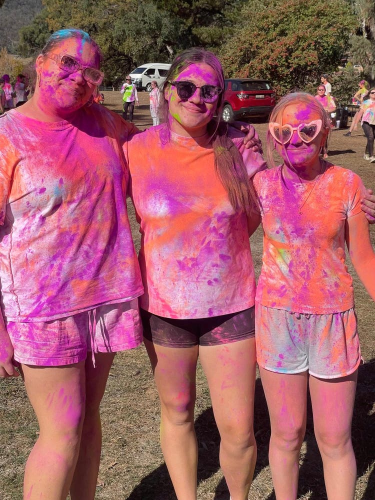 girls enjoying colour run
