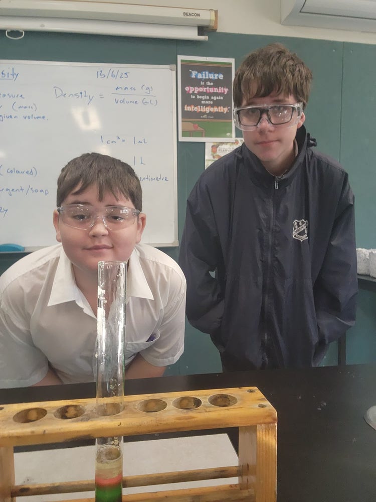 boys posing during science experiment