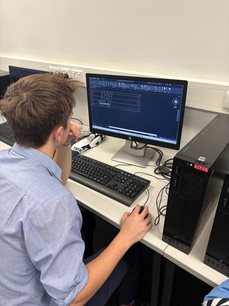 student designing using autocad